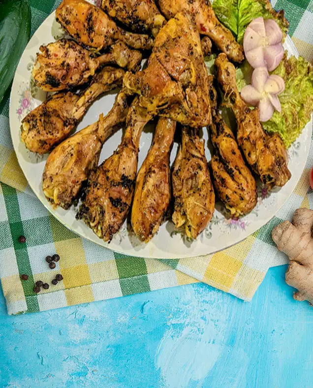 A platter of spiced grilled chicken drumsticks served at Surfing Life