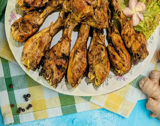 A platter of spiced grilled chicken drumsticks served at Surfing Life